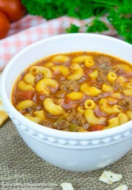 Beef and Tomato Macaroni Soup in a white bowl