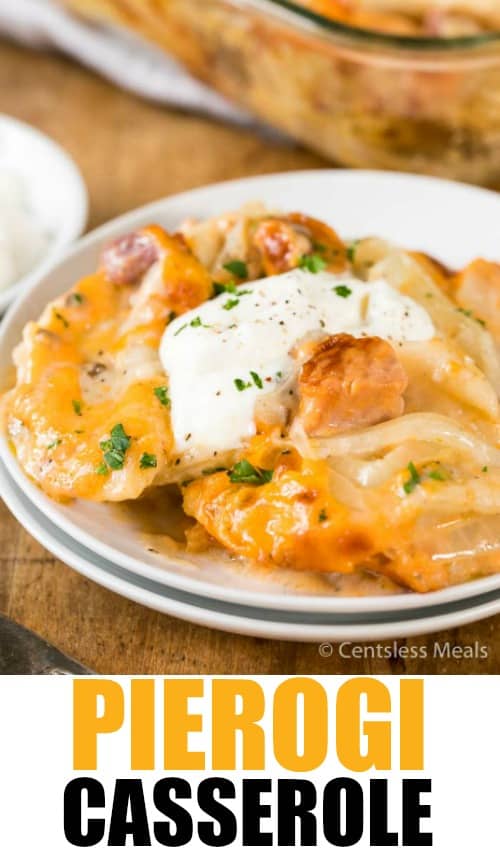 Pierogi casserole on a white plate with sour cream and a title