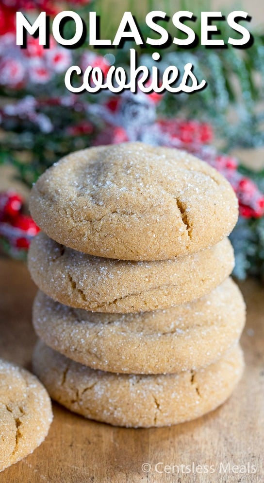 Stack of molasses cookies on a wooden board with writing