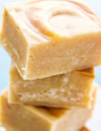 White chocolate peanut butter swirl fudge cut into pieces with a title