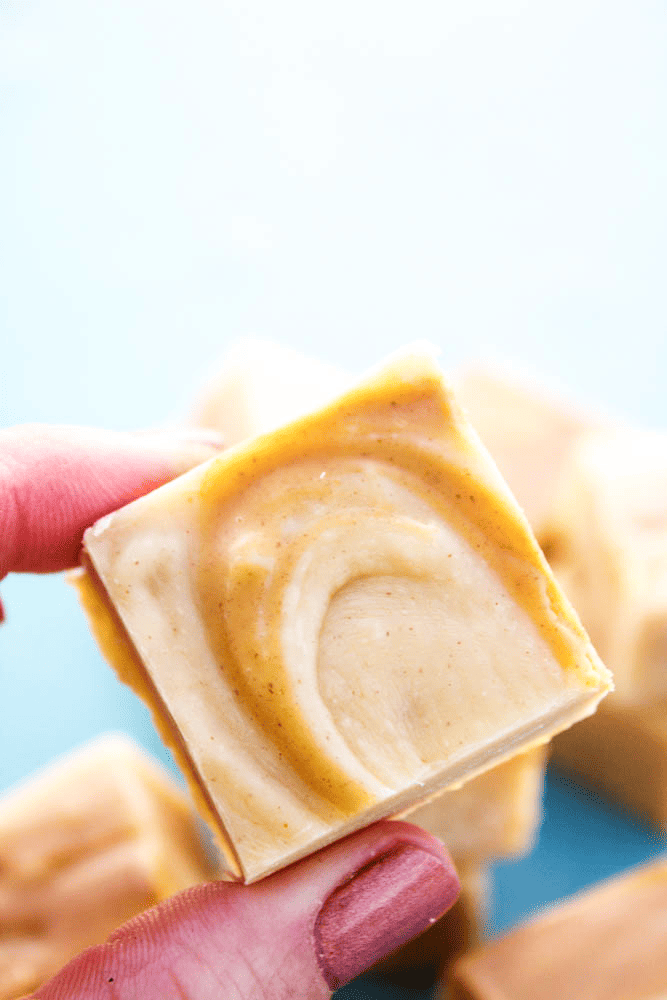 piece of White chocolate peanut butter swirl fudge being held by someone
