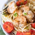 Garlic Shrimp Pasta in a white bowl with a fork