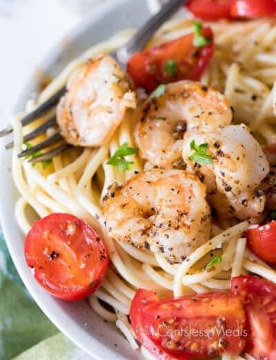 Garlic Shrimp Pasta in a white bowl with a fork