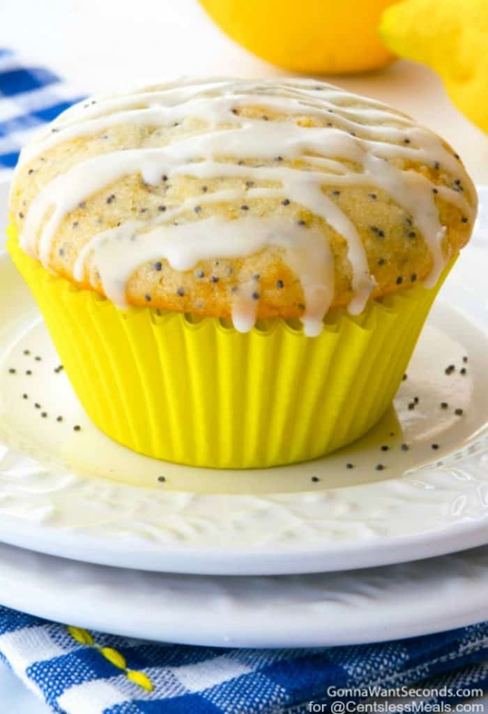 Glazed Lemon Poppy Seed Muffins On A White Plate