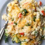 Chicken broccoli rice casserole on a plate with a spoon