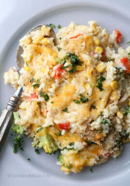 Chicken broccoli rice casserole on a plate with a spoon