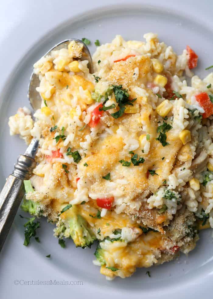 Chicken broccoli rice casserole on a plate with a spoon