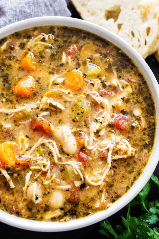Slow cooker chicken soup with bread on the side
