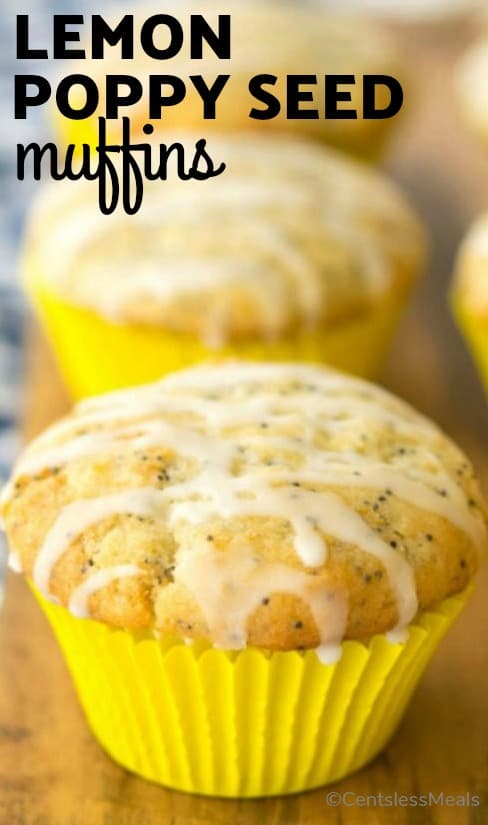 Lemon poppy seed muffins on a wooden board with a title