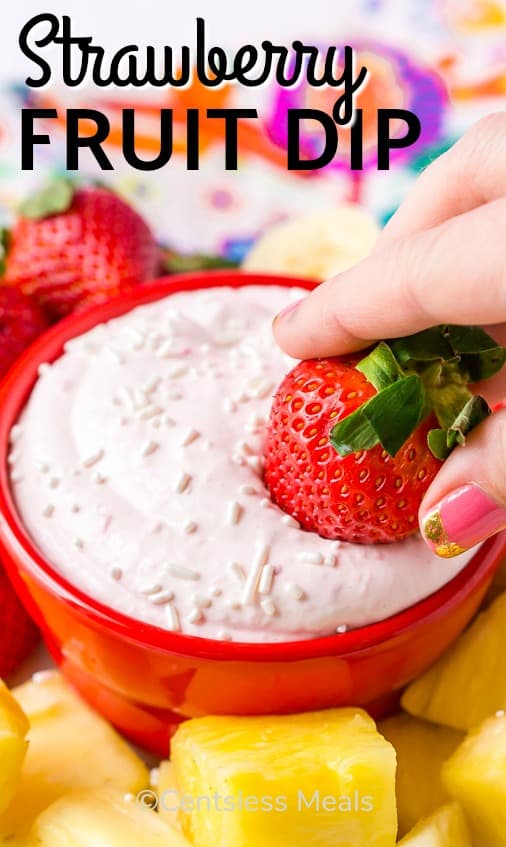 Strawberry fruit dip in a Red Bowl with fruit on the side