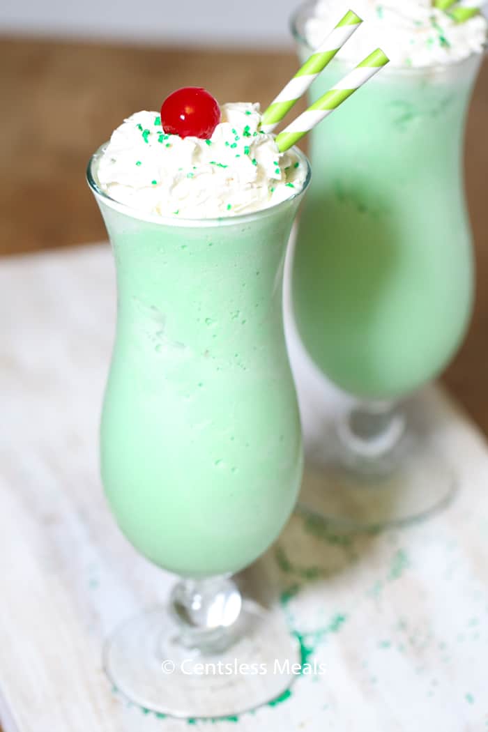 Shamrock Shake in glasses with whipped cream and cherry on top