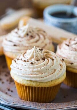 Tiramisu Cupcakes are a delicious take on the classic Italian dessert. Infused with a kahlua and espresso mixture and topped with mascarpone cream.