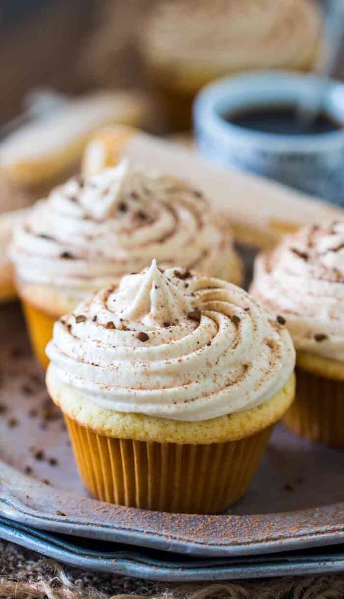 Tiramisu cupcakes on a plate with icing