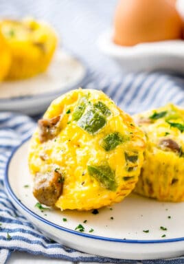 Mini quiche on a plate garnish with parsley
