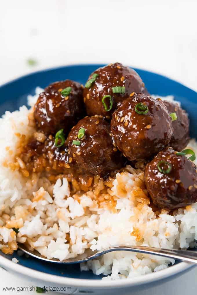 30 minute Teriyaki meatballs in a bowl with rice and a spoon