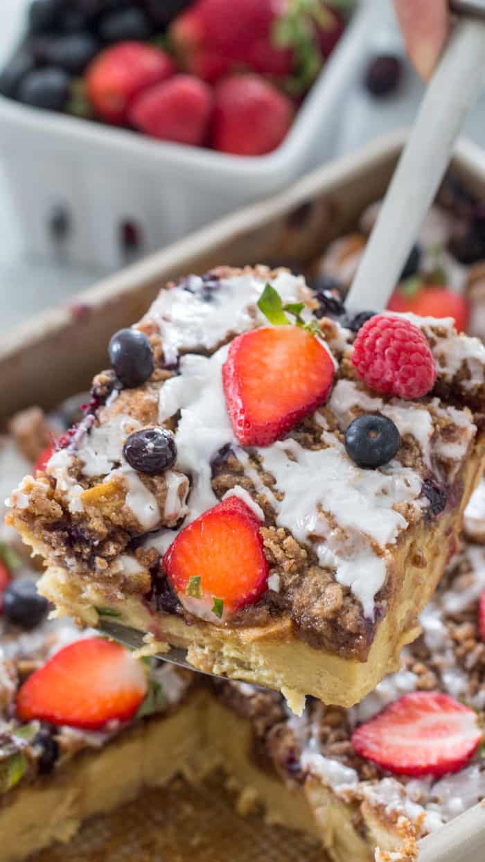 piece of french toast bake with berries and icing