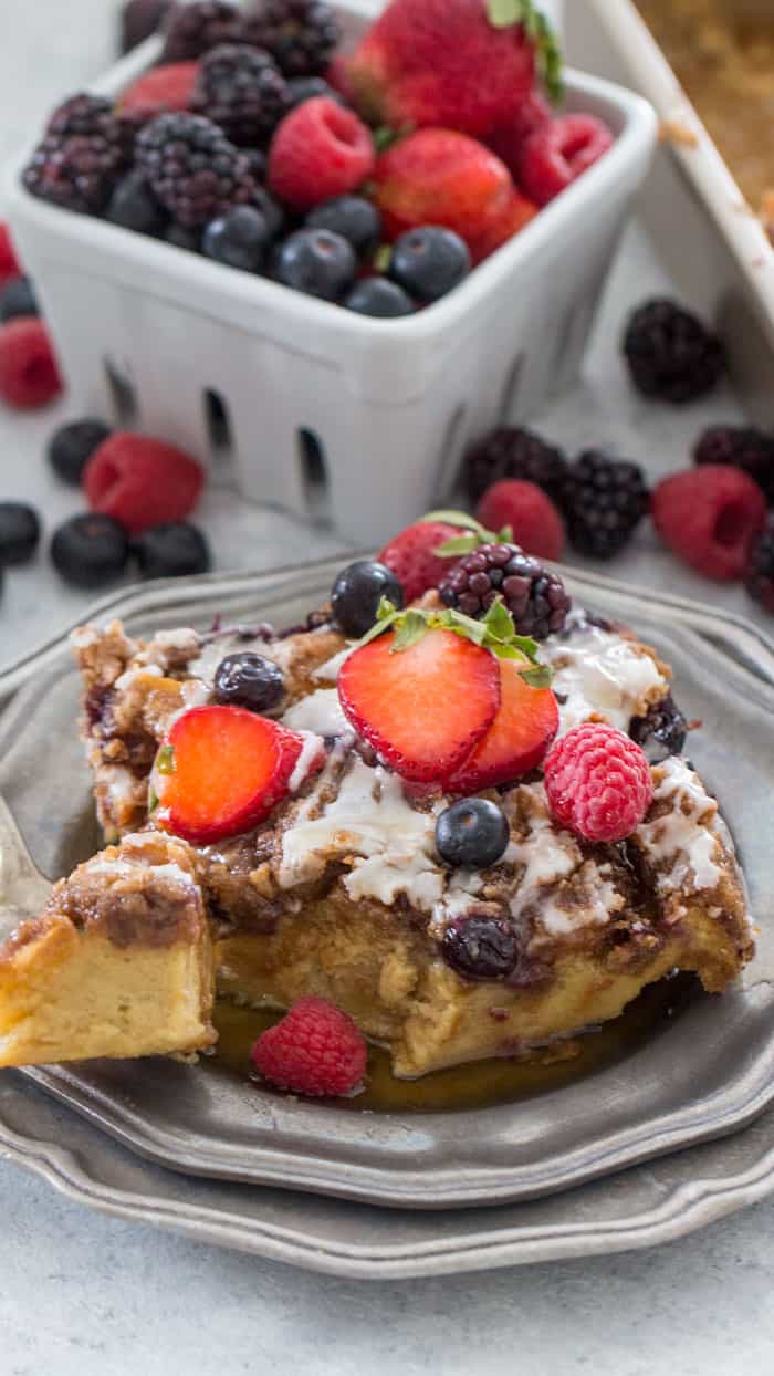 french toast bake on a plate topped with berries