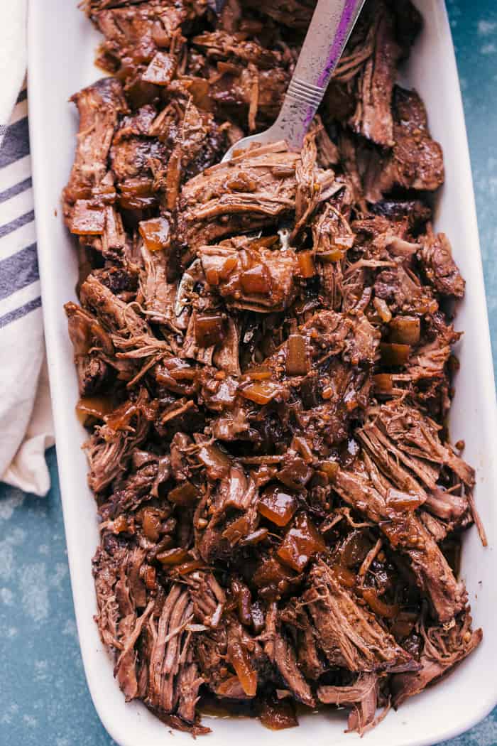 Slow cooker balsamic Roast Beef in a dish with a fork