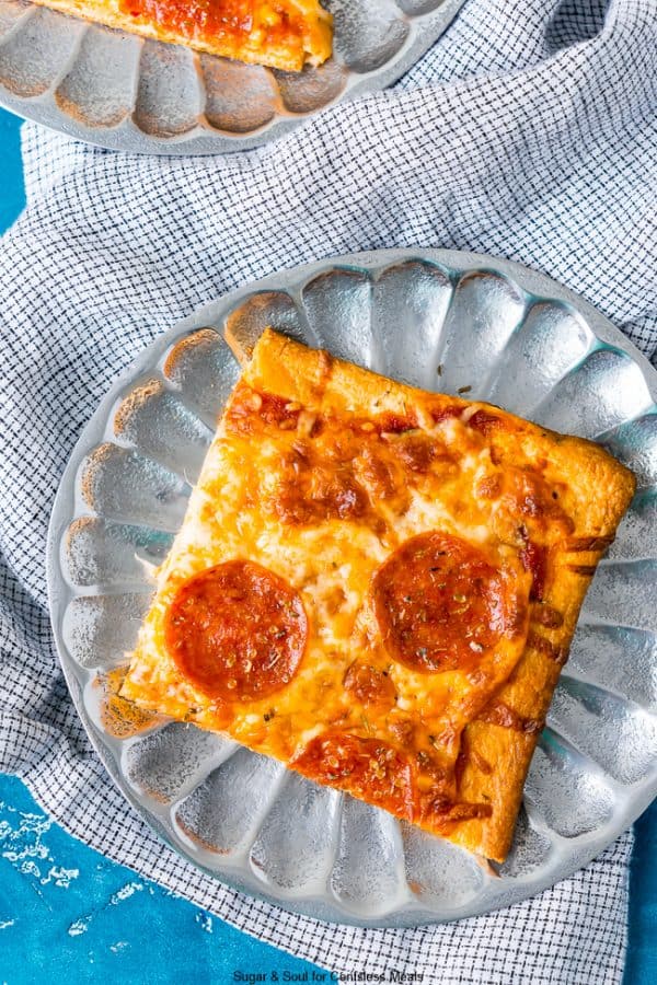 Crescent roll pizza on a metal plate