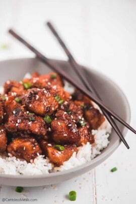 Instant pot honey garlic chicken garnished with green onion and sesame seeds