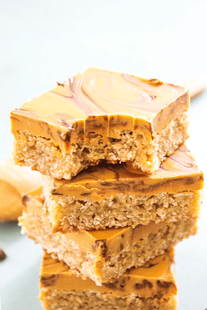 Stack of butterscotch bars with a bite taken out of 1