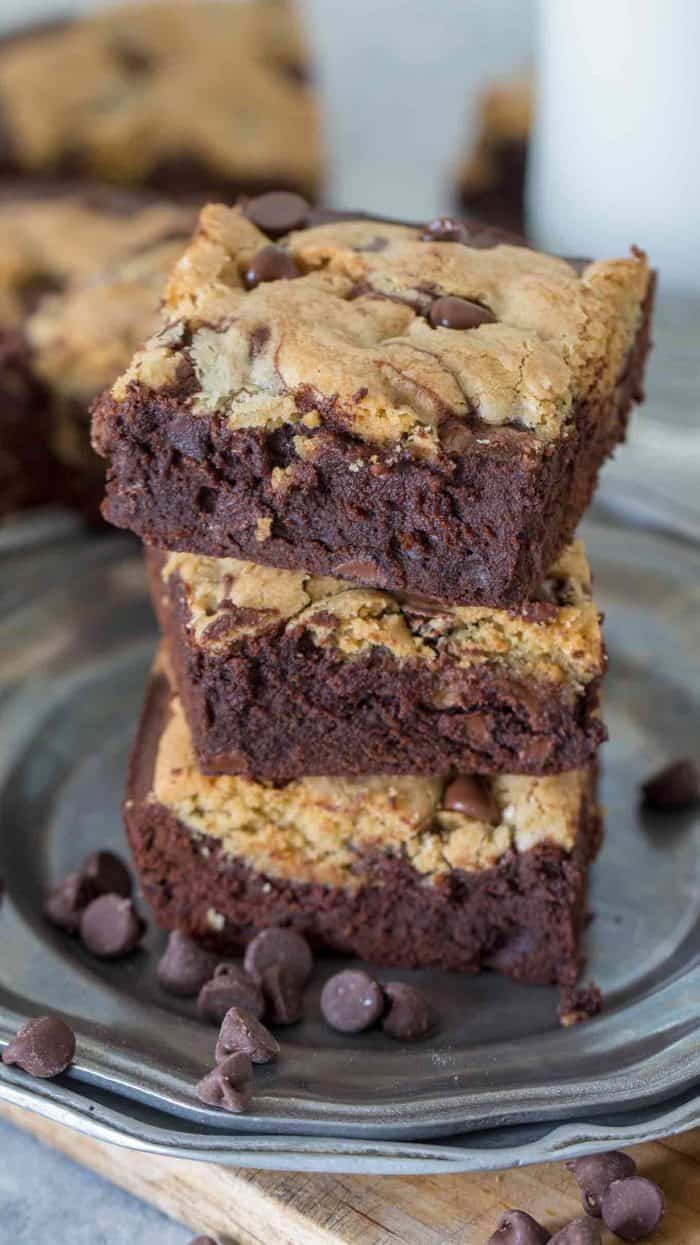 Three brookie bars on a plate with chocolate chips