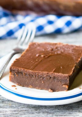 Coca Cola Cake on a blue rimmed white plate