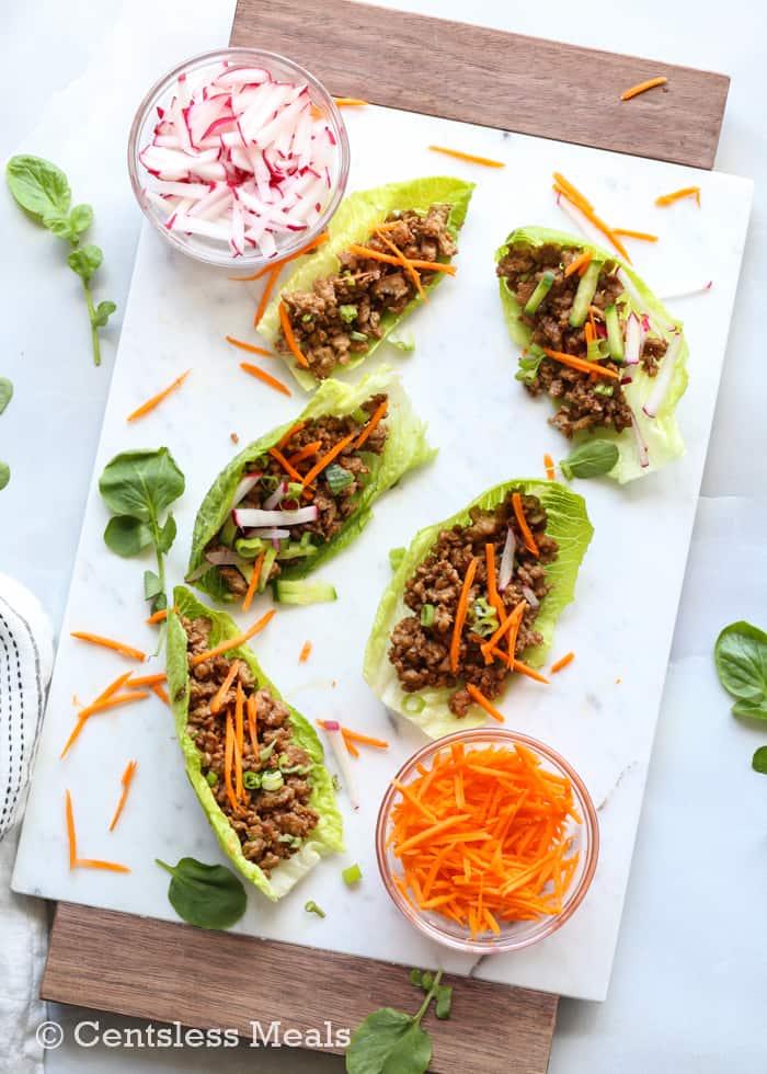 Chicken lettuce wraps on a marble board