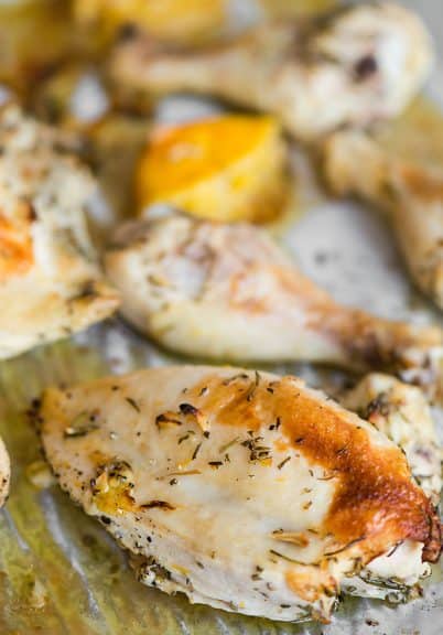 Oven Baked Rosemary Chicken is a healthy dinner option that uses bone-in and skin-on chicken pieces that have been marinated in a flavorful lemon rosemary olive oil marinade. #centslessmeals #chickenrecipe #easyrecipe #roastedchicken #simpledinner #bakedthighs #chickenpieces #lemonmarinade #healthyrecipe