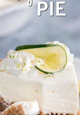 Piece of no-bake key lime pie on a plate with a bite taken out and writing