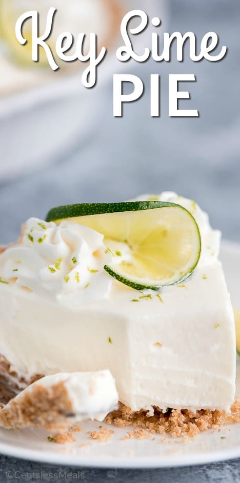 Piece of no-bake key lime pie on a plate with a bite taken out and writing