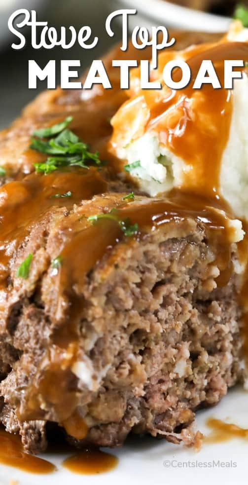 Stove top meatloaf on a plate with gravy and a title