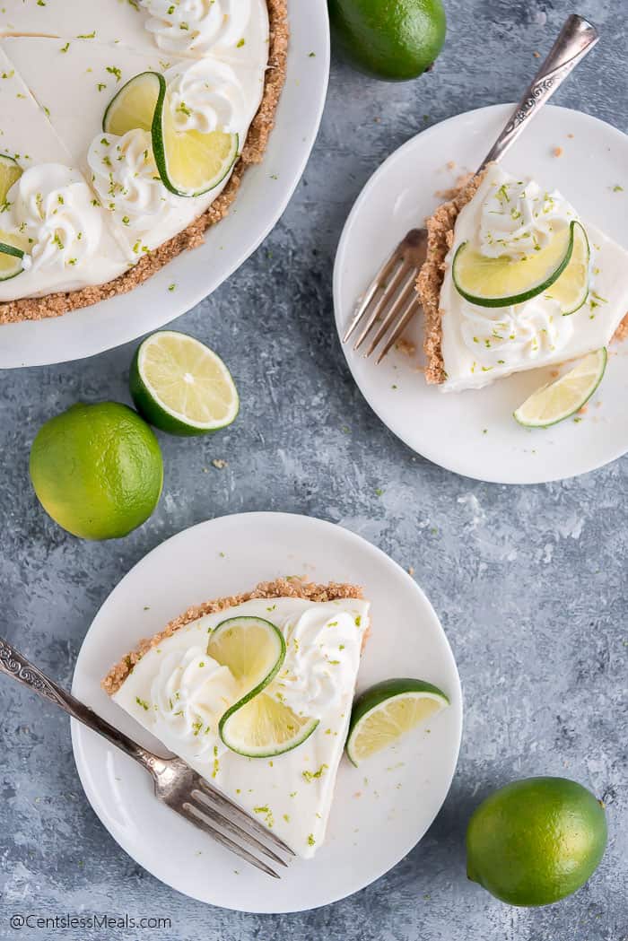 Two plates with pieces of Key Lime Pie and forks