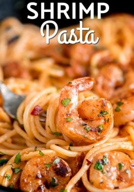 Shrimp pasta with a fork and a title