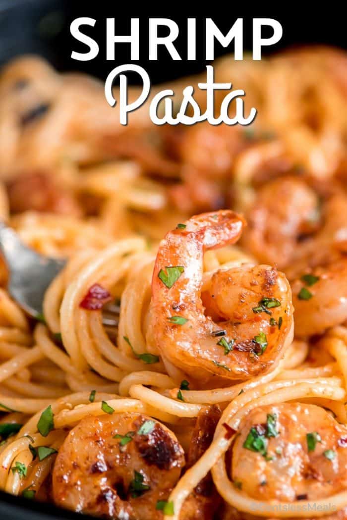 Shrimp pasta with a fork and a title