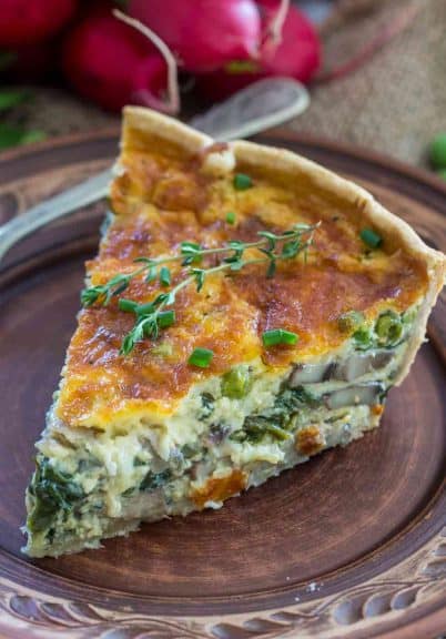 Spinach Quiche Recipe that is buttery, creamy and can be loaded with your favorite veggies. Makes for a delicious make ahead breakfast and is perfect for brunch!