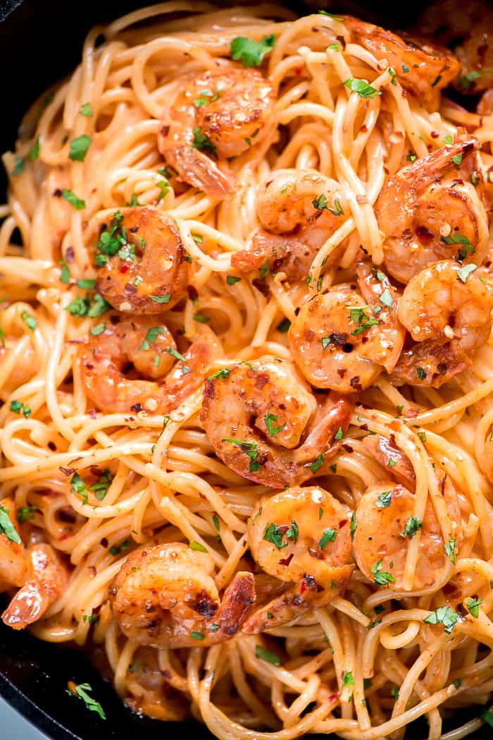 Bang bang shrimp pasta in a pan with cilantro on top