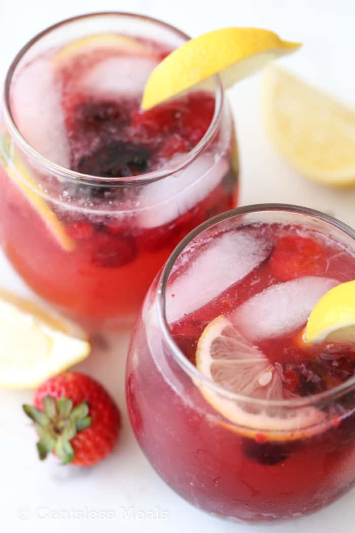 Lemonade in glasses garnished with lemons