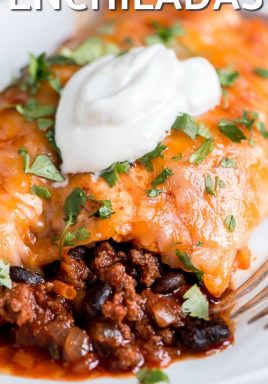 Beef enchiladas on a plate with sour cream and a title