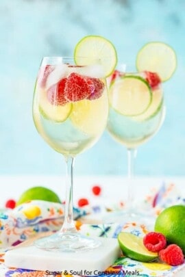 Wine glasses filled with raspberry lime wine spritzer