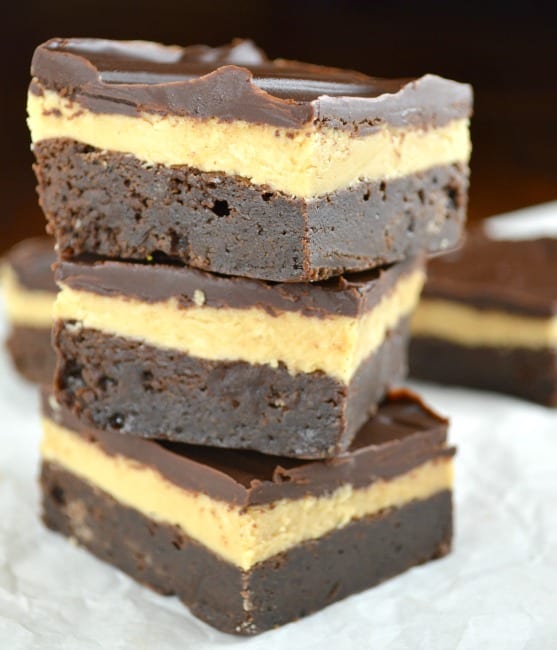 Dark chocolate peanut butter truffle brownies on parchment paper