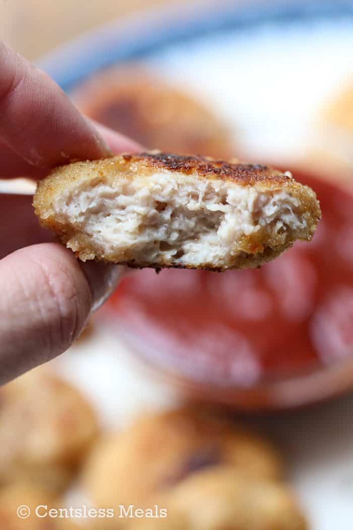 Homemade chicken nuggets with a bite taken out of 1