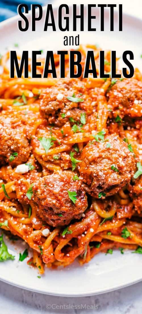 Spaghetti and meatballs on a plate with a title