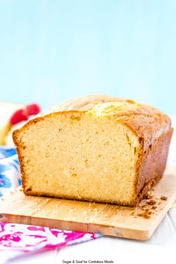 Almond pound cake on a wooden cutting board