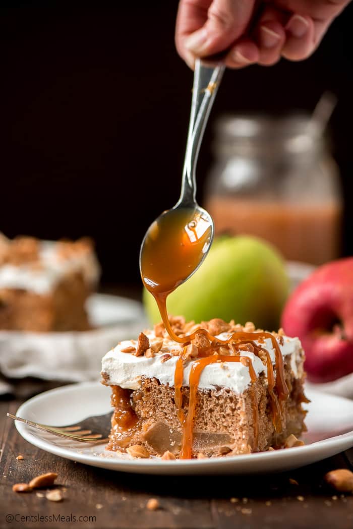 Caramel apple poke cake caramel apple poke cake being drizzled with caramel