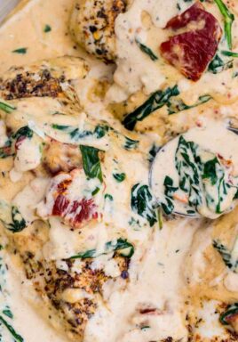 Creamy Tuscan Chicken is made in one pan in just 30 minutes. Made with flavorful dried herbs, rich cream, tangy sun dried tomatoes and fresh spinach.
