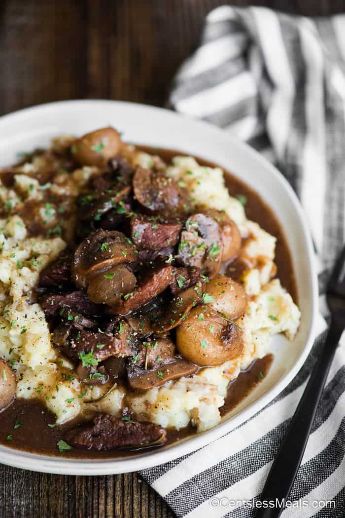 white bowl of potatoes and beef burgandy