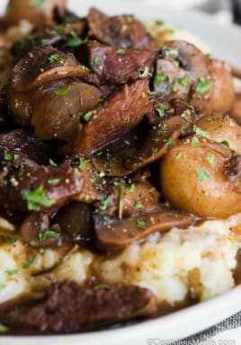 beef and mushrooms in gravy over mashed potatoes