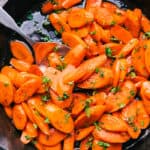 Candied carrots with a spoon and parsley