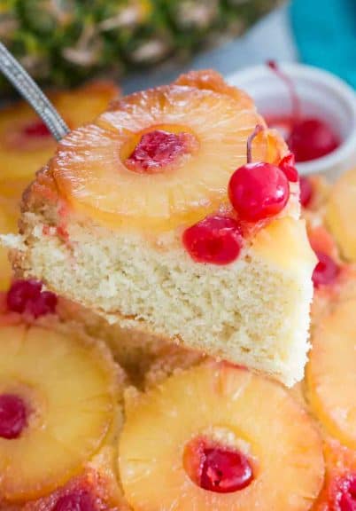 Pineapple Upside Down Cake is the perfect easy dessert. Homemade vanilla sponge cake is soft and tender, topped with juicy caramelized pineapple slices.